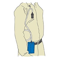 Cassette attached to worker's clothing in breathing zone. Personal sampling pump clipped to trouser belt.