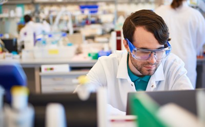 Lab worker at his station. Lab worker at his station.