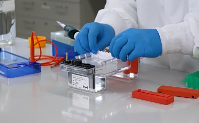Nucleic Acid Gel Electrophoresis Lab technician working with lab equipment.