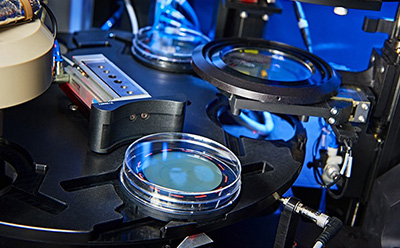 Close-up of the Growth Direct® System's detection chamber, showcasing petri dishes and automated colony enumeration and detection.