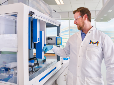 Scientist Fist Bumping AAW™ Workstation Smiling male scientist fist bumping the AAW™ workstation