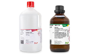 Acids The image depicts two chemical bottles: a larger white bottle with a red cap and hazard symbols, and a smaller brown glass bottle with a black cap and green and white label.