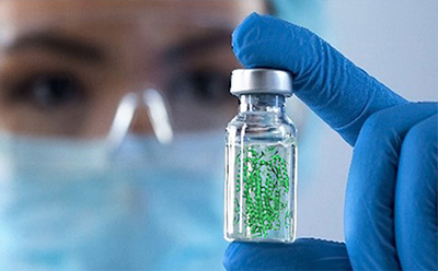 Scientist holding a vial containing glycoconjugate-related compounds for glycoscience and biomolecular research applications.