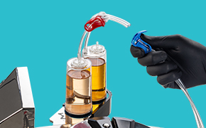 Cutting of the Steritest NEO tubing with the Velax cutting clamp Operator cutting the tube of the Sterility Testing Steritest device with the Velax cutting clamp