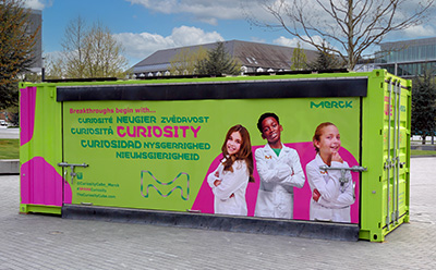 Curiosity Cube, a brightly colored shipping container used for science experiments.