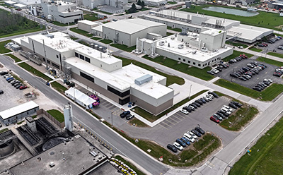 Exterior of CDMO Sheboygan, Wisconsin facility — a dedicated US manufacturing site for PEGylation, polyethylene glycol synthesis, and small-molecule drug production