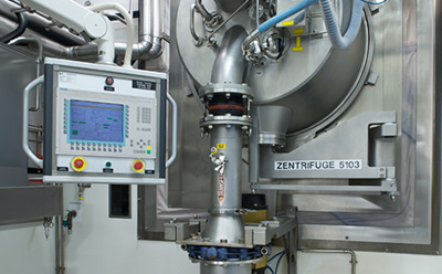 Controlled substance GMP centrifuge manufacturing Industrial GMP centrifuge (Zentrifuge 5103) with Siemens HMI control panel in a sterile white cleanroom for controlled substance small-molecule manufacturing at Schaffhausen