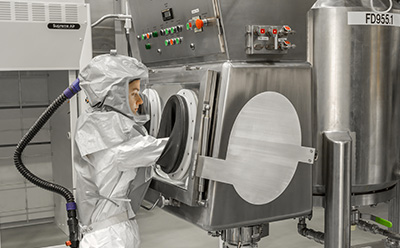 Difficult-to-filter compound processing Pharmaceutical scientist operating advanced filtration equipment for difficult-to-filter small-molecule compounds under GMP conditions at the Verona CDMO facility