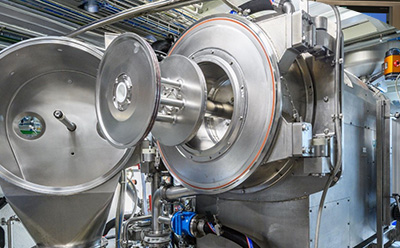 PEGylation drum reactor manufacturing Large stainless steel drum reactors and conical hopper systems for PEGylation and polyethylene glycol (PEG) small-molecule manufacturing in a GMP cleanroom