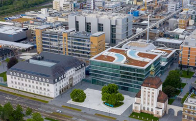 Exterior view of the CDMO G20 manufacturing building in Darmstadt, Germany — a key European site for complex small-molecule pharmaceutical development and production