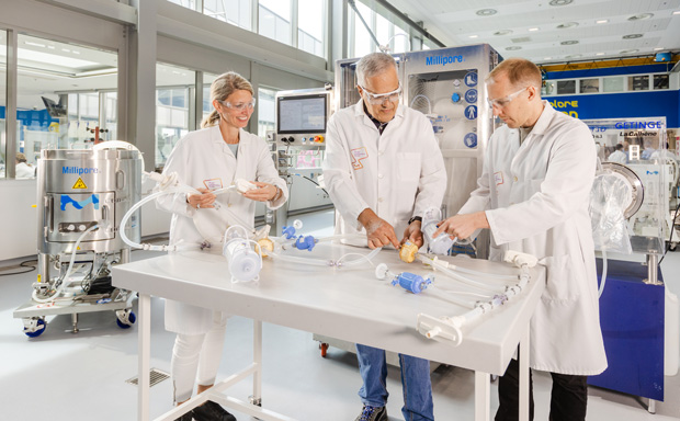 Aseptic Processing Expertise and Final Fill Solutions Team members reviewing single-use components and equipment for aseptic final fill manufacturing.