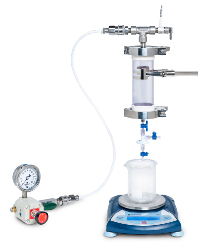 Constant pressure filter sizing test set-up Pressure gauge is shown on left connected by tubing to the pressure vessel which is filled with product and has metal clamps to secure in place above the small-scale filter (white). Blue valves allow venting of the system