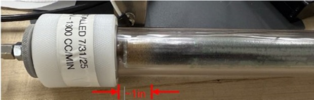 : Close-up of an OMI®-4 gas purifier tube with a small discolored section of about 1 inch, indicating minimal contaminant consumption after extended continuous use.