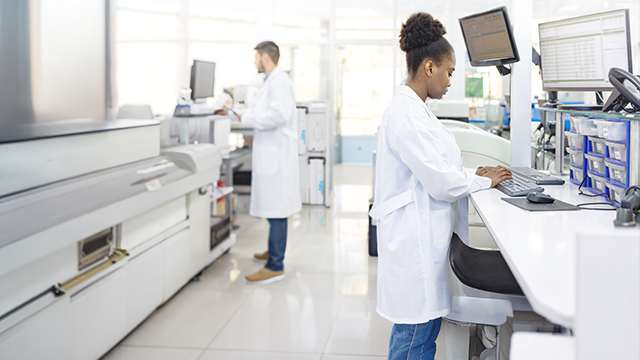 People working in a clean, well lit lab