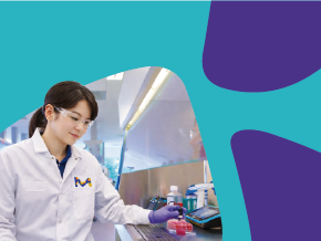 A laboratory scene showing a scientist in a white lab coat handling a laboratory container; the face is blurred for privacy. The background features teal and purple abstract shapes.
