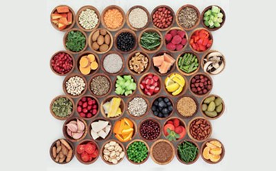 An array of colorful spices and ingredients, each housed in individual round bowls, neatly arranged An array of colorful spices and ingredients, each housed in individual round bowls, neatly arranged