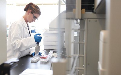 Purple glove and pipette