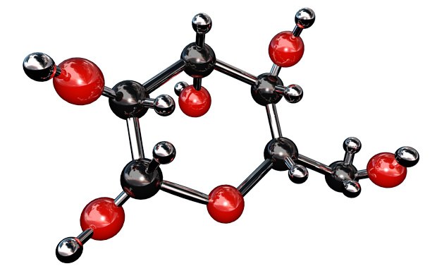 Carbohydrate Molecule The image displays a 3D molecular model with black and red spheres representing atoms, connected by rods to illustrate chemical bonds. The black spheres are smaller and likely depict carbon atoms, while the red spheres could represent oxygen atoms, suggesting an organic compound.