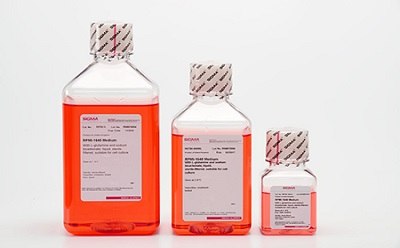 RPMI-1640 Media Three bottles of RPMI 1640 Media, ranging from big to small. Containing an orange liquid with safety seals on the caps.