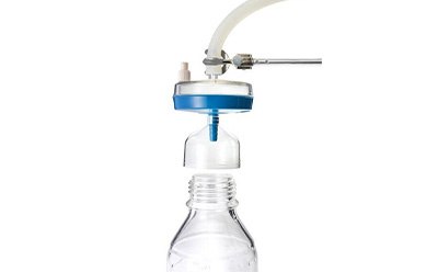 Steripak™ filters The image appears to be of a water filtration system, where a tube from the filter is directed into the opening of a clear plastic water bottle.