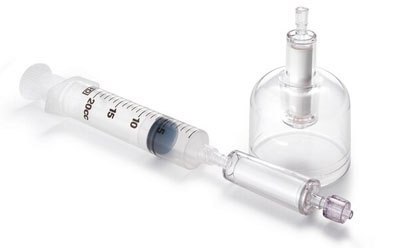 Sterivex® filters The image appears to be a medical or laboratory setup, featuring a syringe connected to a glass bottle with a stopper and an outlet. The syringe has measurement markings, and the glass bottle resembles a reagent bottle used for storing chemicals or solutions in scientific labs.