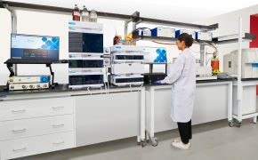 Process Analytical Technology Tools Scientist using Process Analytical Technology tools in a lab.
