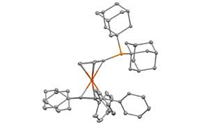 A 3D molecular model showing the structure of a complex organometallic compound. The model features gray spheres representing carbon atoms and orange lines indicating bonds to a central metal atom, likely phosphorus or a transition metal. The structure includes multiple aromatic rings and a cage-like ligand arrangement.