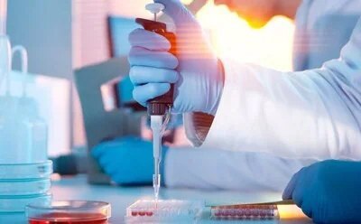 Lab scientist conducting testing in a lab environment