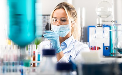 Showing female scientist working in the lab