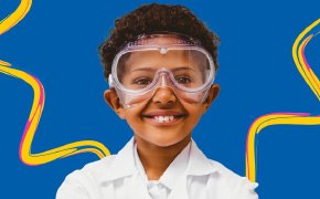 A promotional poster for the SPARK™ program featuring a young child dressed in a white lab coat and safety goggles, symbolizing curiosity and scientific exploration. The vibrant blue background includes the text "Curiosity Experiments" and the SPARK™ logo, inviting viewers to engage with hands-on science activities.