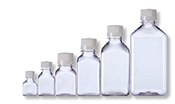 A collection of six clear glass bottles of varying sizes, arranged in ascending order from smallest to largest, against a white background. A collection of six clear glass bottles of varying sizes, arranged in ascending order from smallest to largest, against a white background.