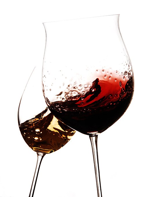 Heavy metals are often found in wine Two glasses of splashing red wine