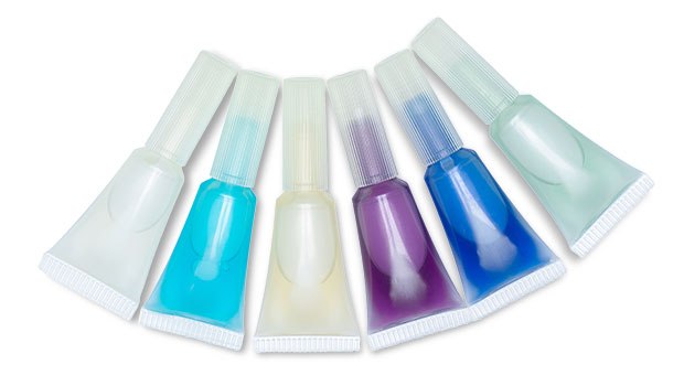 Ready-to-use liquid media ampoules A collection of six 2 mL ready-to-use media ampoules in various colors are placed against a white background