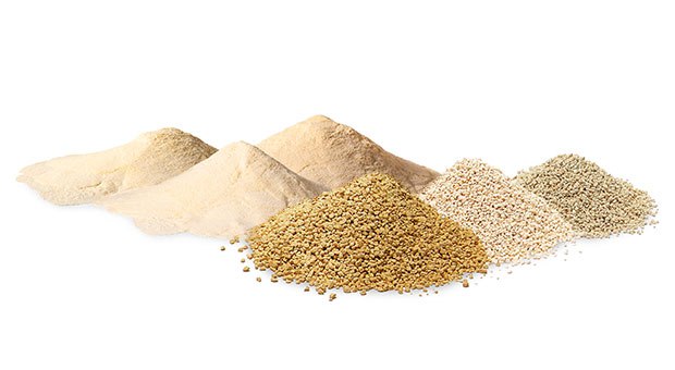 Powdered and granulated culture media for microbial growth and detection Two types of culture media are displayed as mounds on a white background. The left side features three powdered media, while the right side showcases three different shades of granulated powders, ranging from beige to light brown.