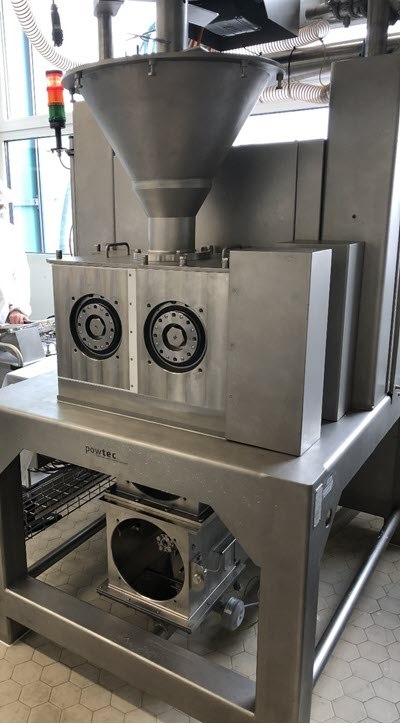 Roller compactor for dry granulation Roller compactor for dry granulation standing in pharmaceutical lab