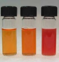 Aqueous orange-red selenium nanoparticles Photograph of aqueous dispersions of selenium nanoparticle ranging in color from orange to red.